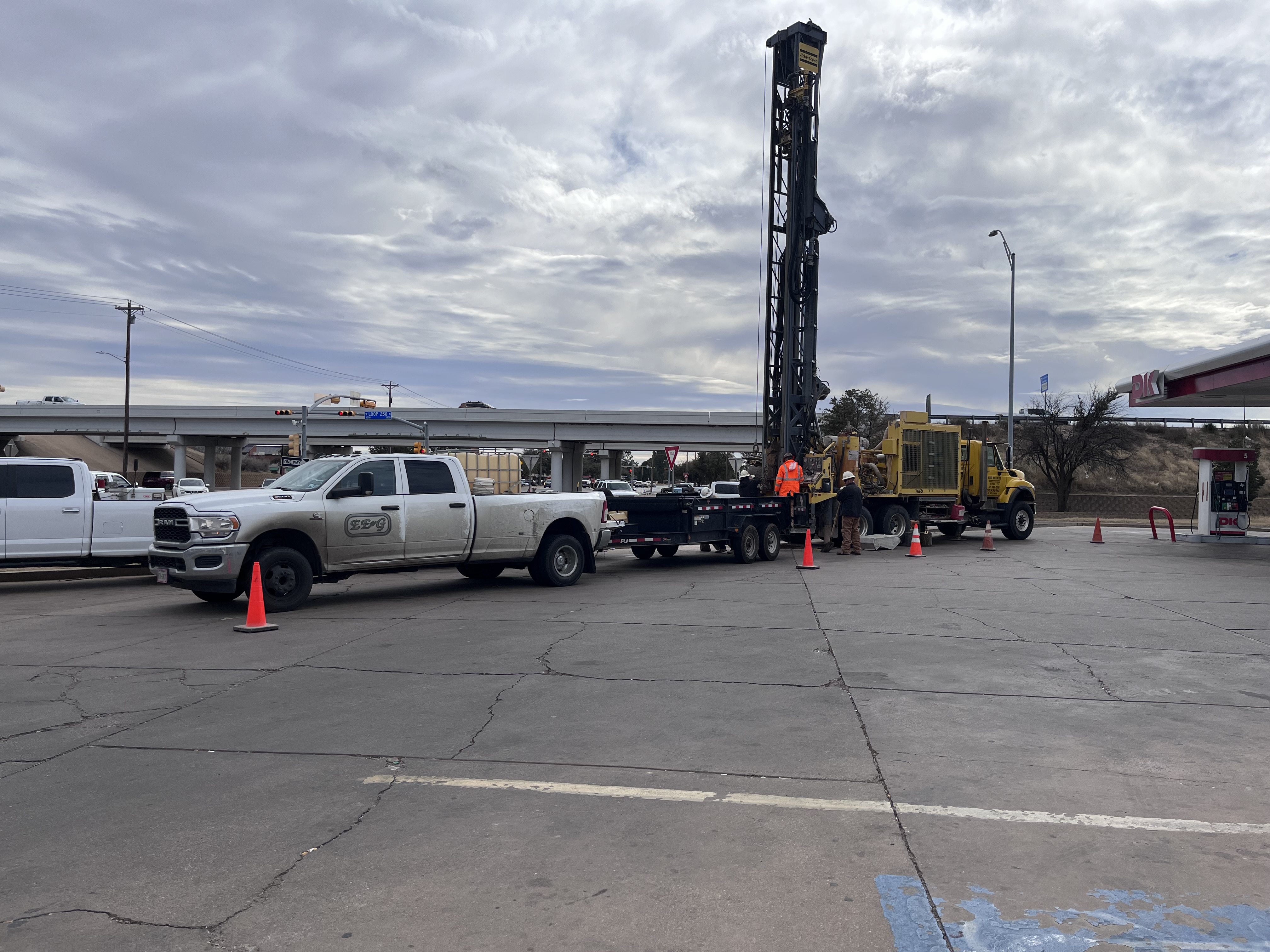 EE&G truck and drill rig at a commercial job site
